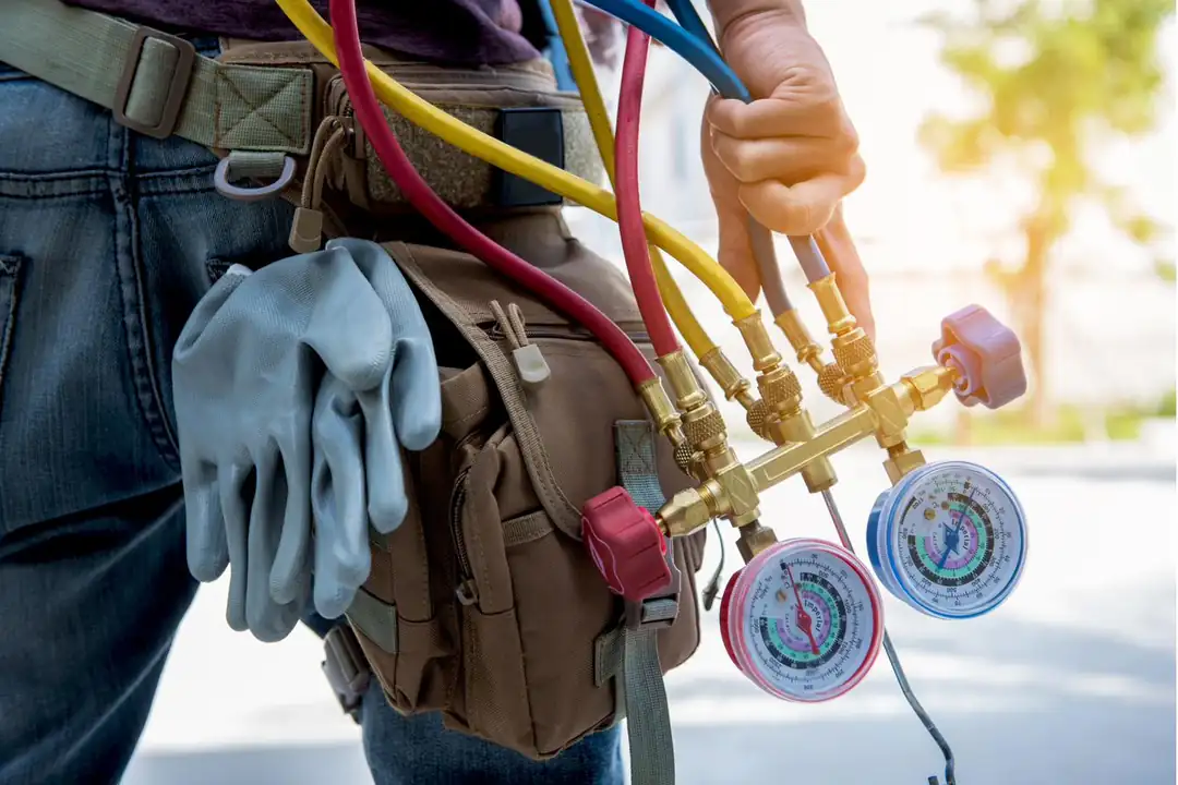 Shane & Son's technician checking refrigerant pressures with a manifold gauge set on a Central New York service call